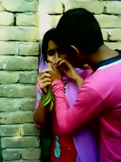 Young couple enjoy outdoor kiss and foreplay infront of friend